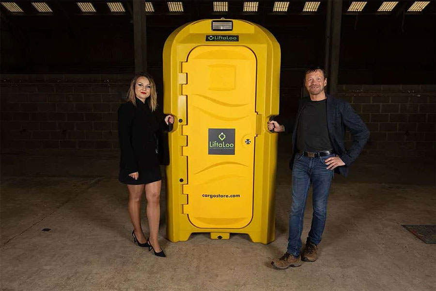 Ekaterina Burge & Jon Aldiss standing beside the Liftaloo.